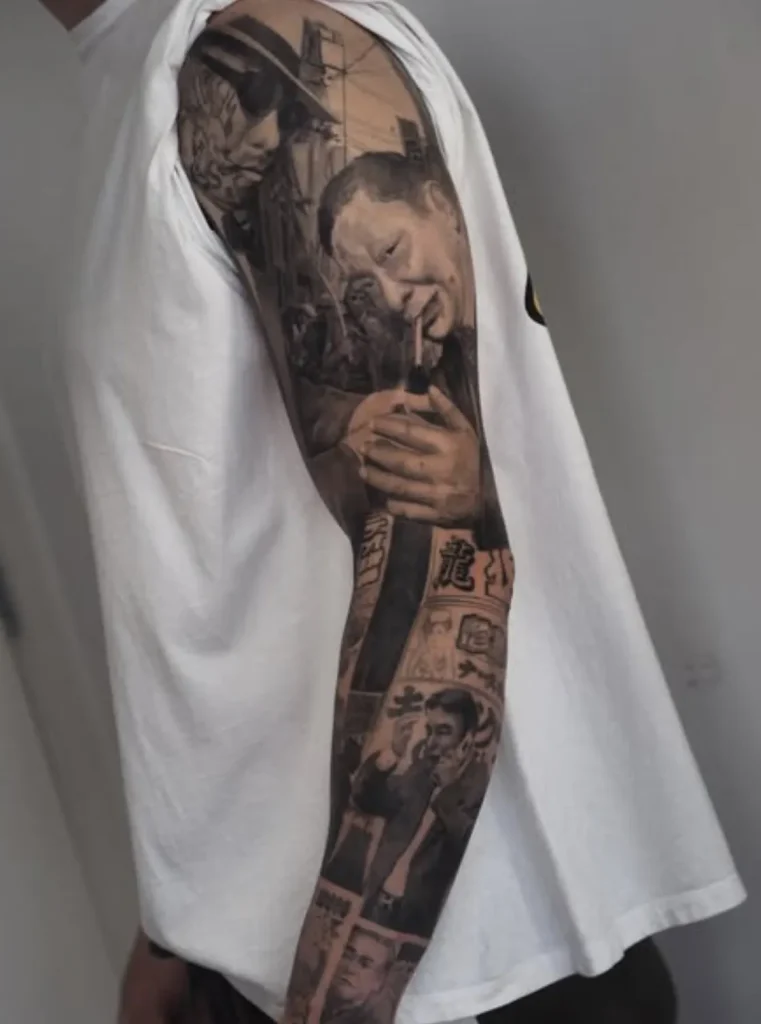 Custom sleeve tattoo Melbourne featuring storytelling black and grey realism with multiple portrait elements